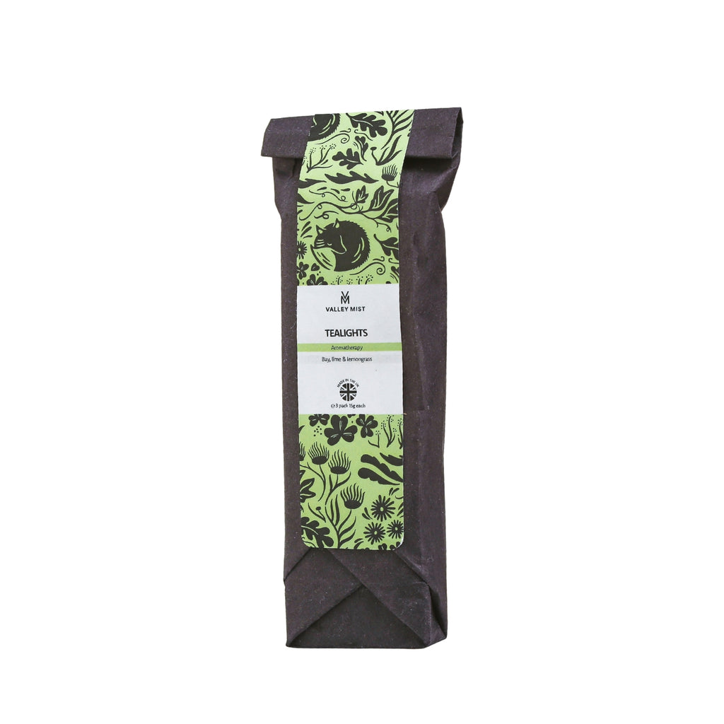 Valley Mist Bay, Lime & Lemongrass aromatherapy tea lights with pure essential oils, pack of three in black paper packaging with a green botanical label.