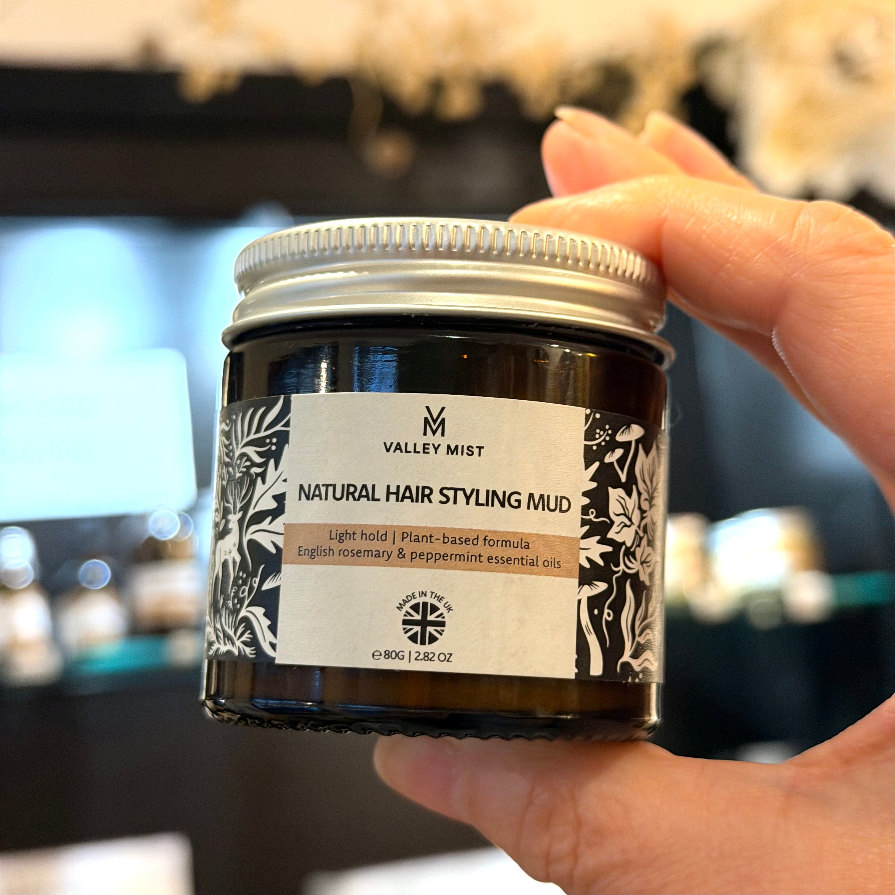 hand held natural hair styling mud in the location that it is handmade.