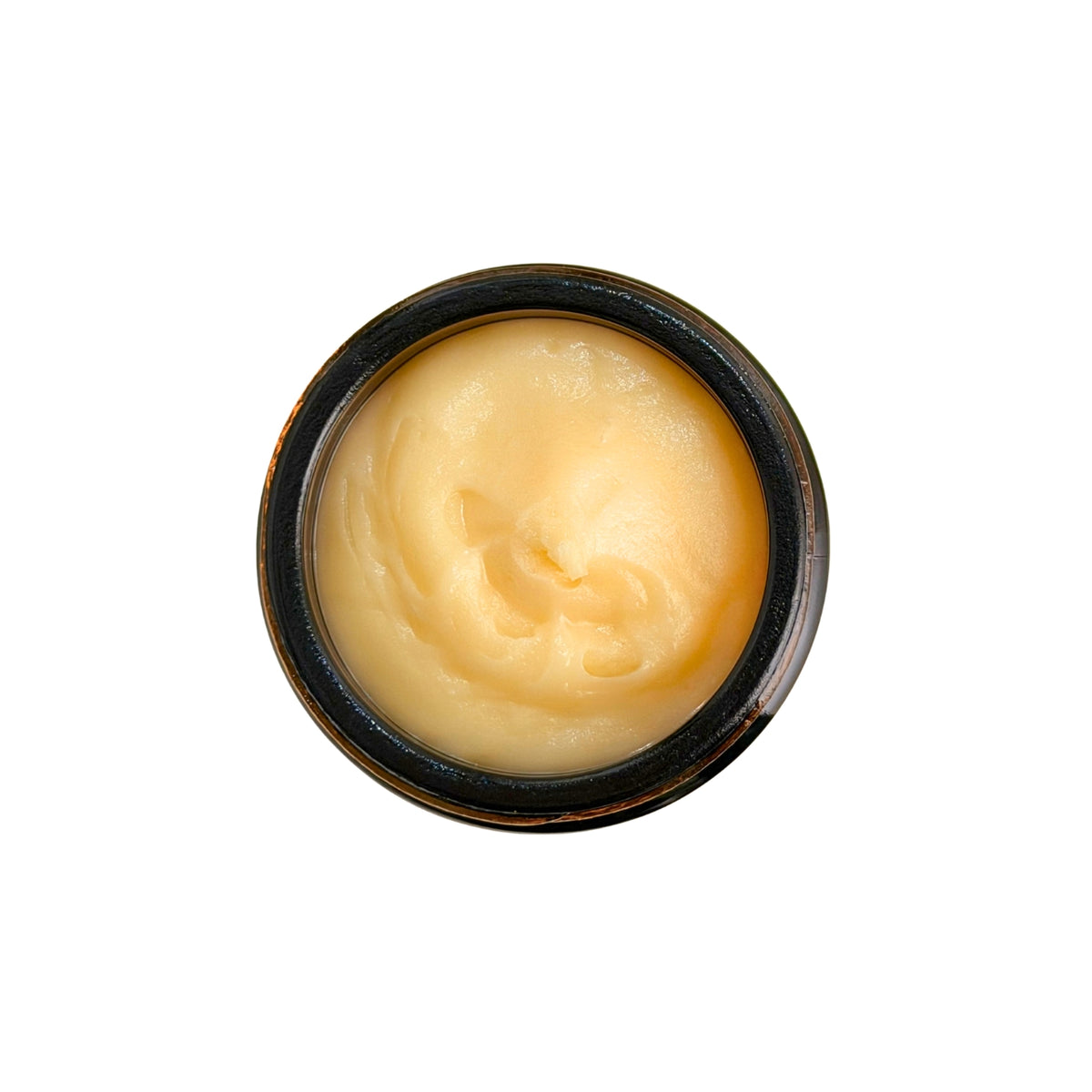 detail image of water-less body butter in amber glass jar