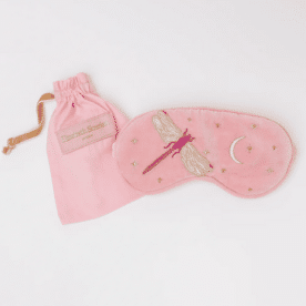 Pink eye mask with dragonfly and moon embroidery, lavender filled for a restful sleep.