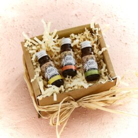 uplifting essential oils gift box on pink background